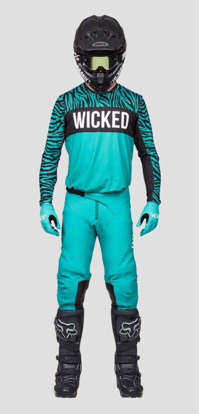 the front image of a man in the edge mx gear set teal