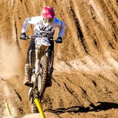 Dirt bike rider in white action jersey