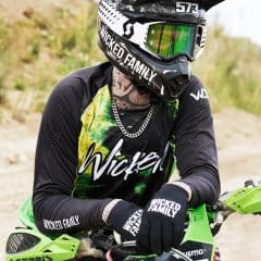 MX rider in tie-dye gear chilling out