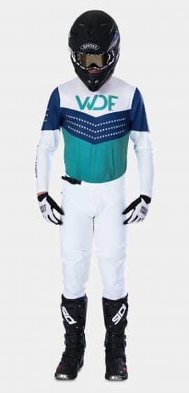 the front image of a man in the block mx gear set teal/white
