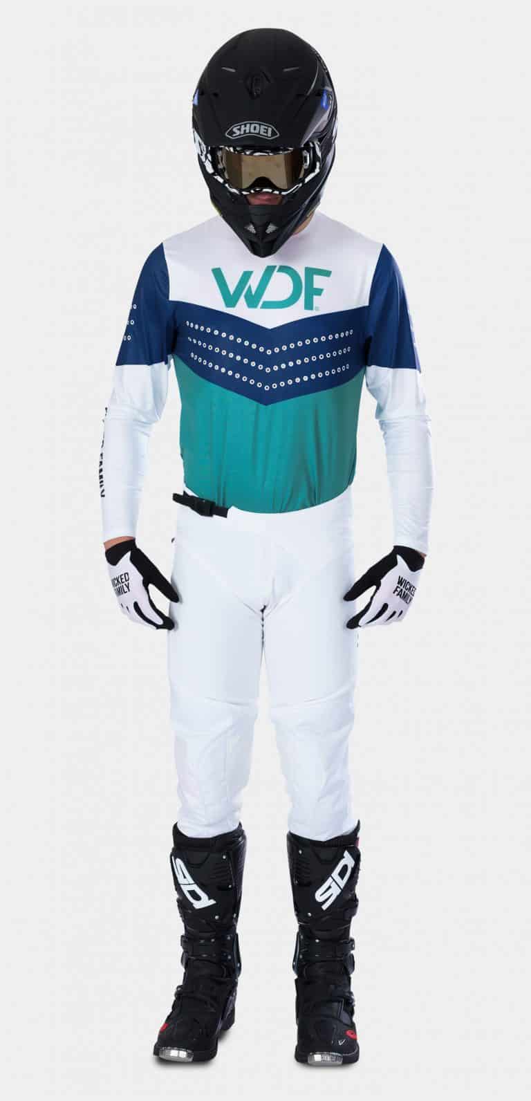 the front image of a man in the block mx gear set teal/white