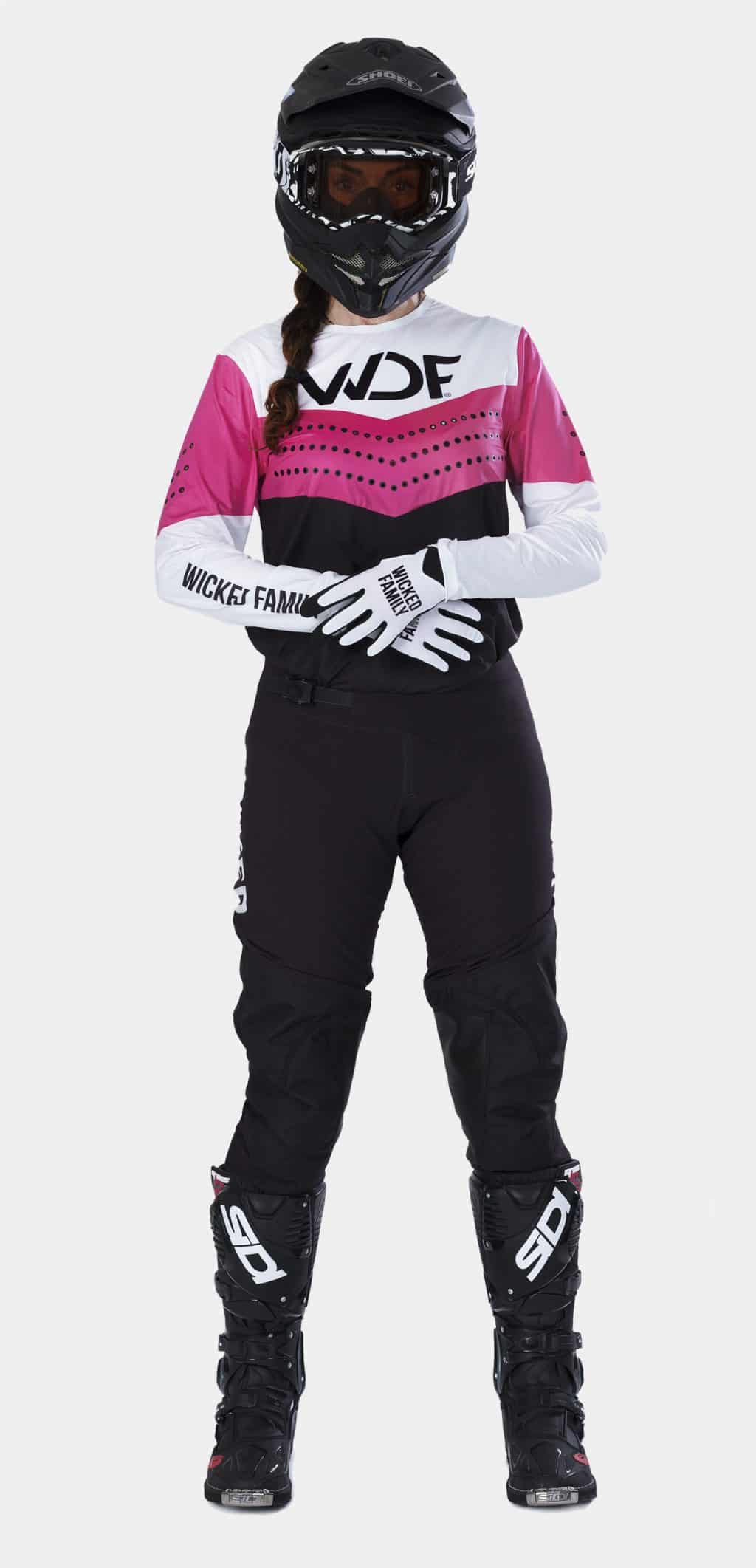Block womens MX gear in pink and black on woman