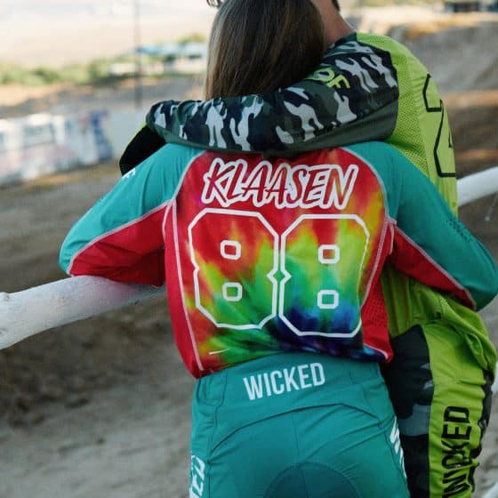 Couple hugging at the track