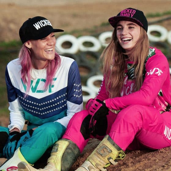 Two girls laughing at the track